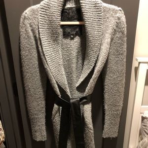 Gray sweater with leather wrap